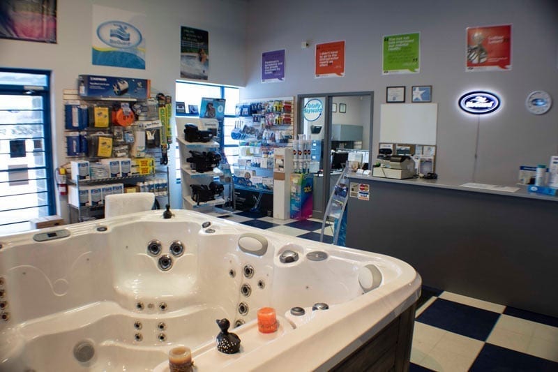 Hot tubs and furnishings on display in a showroom